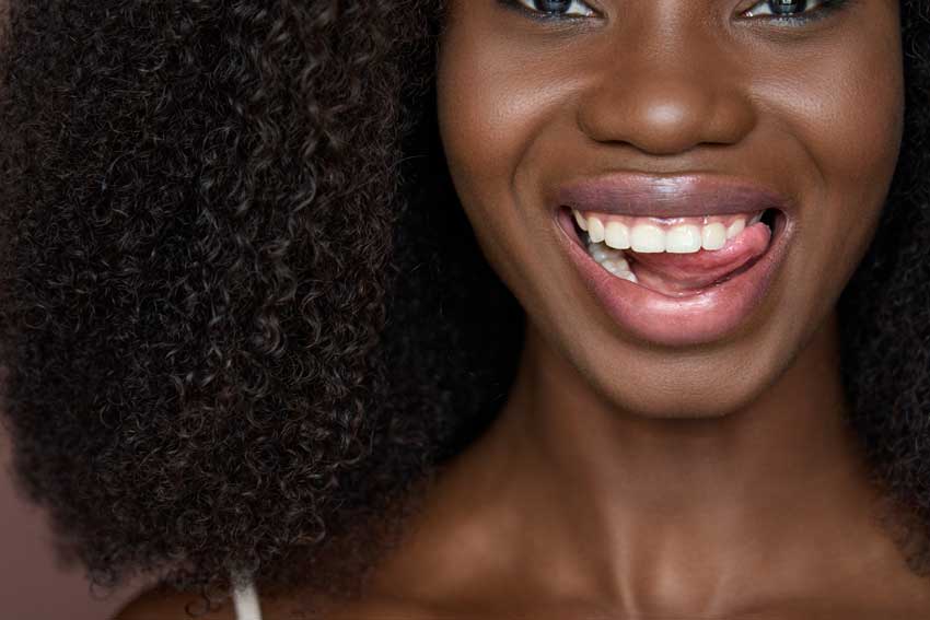 Smiling woman after teeth whitening